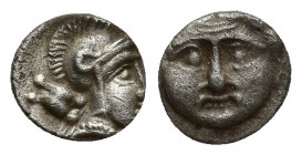 Pisidia, Selge, Obol, 0.8gr, 9.6mm. 350-300 BC Obverse: facing gorgoneion Reverse: head of Athena in corynthian helmet right astragalos to left