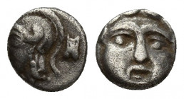 Pisidia. Selge circa 350-300 BC. Obol AR 8.7mm., 0,7g. Facing gorgoneion with protruding tongue / Head of Athena to left, wearing crested Attic helmet...