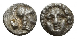 Pisidia, Selge, Obol, 0.9gr, 8.6mm. 350-300 BC Obverse: facing gorgoneion Reverse: head of Athena in corynthian helmet right astragalos to left