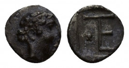 IONIA. Kolophon. Tetartemorion (Circa 450-410 BC). 0.3g 7mm Obv: Laureate head of Apollo right. Rev: TE monogram (mark of value) in incuse square; ast...