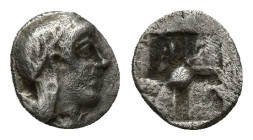 Greek Coins circa 450-400 BC. Tetartemorion AR 7.3mm., 0,2g. Helmeted head of Athena right / incuse square.