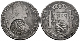 Charles IV (1788-1808). 8 reales. 1805. Potosí. PJ. (Cal-1010). Ag. 26,05 g. Double counterstamp of Minas Gerais to circulate in Brazil (MBC+). Choice...