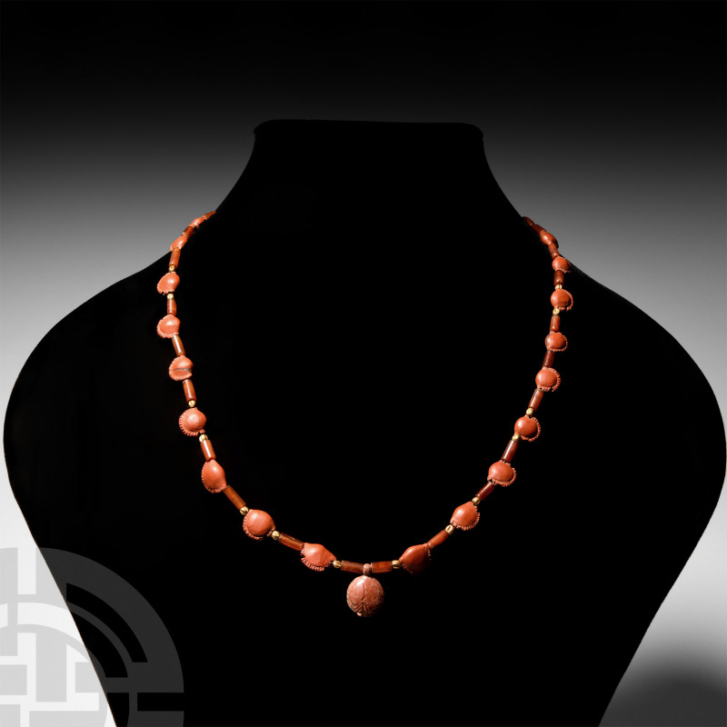 Egyptian Jasper Mandrake Fruit Amulet Necklace. New Kingdom, 1550-1070 B.C. A re...