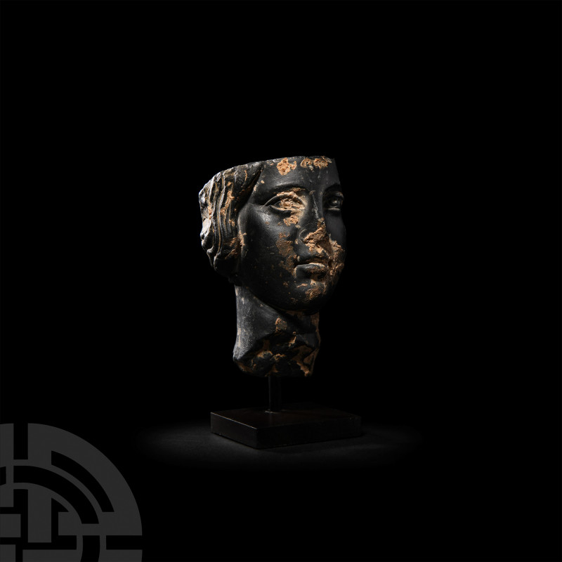 Egyptian Basalt Head of a Woman. Roman Period, 2nd-3rd century A.D. A fragment o...