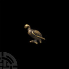 Egyptian Gold Bird Amulet. 1st millennium B.C. A bifacial gold amulet formed as a vulture, with detailing to the head, closed wings, tail and feet; pi...