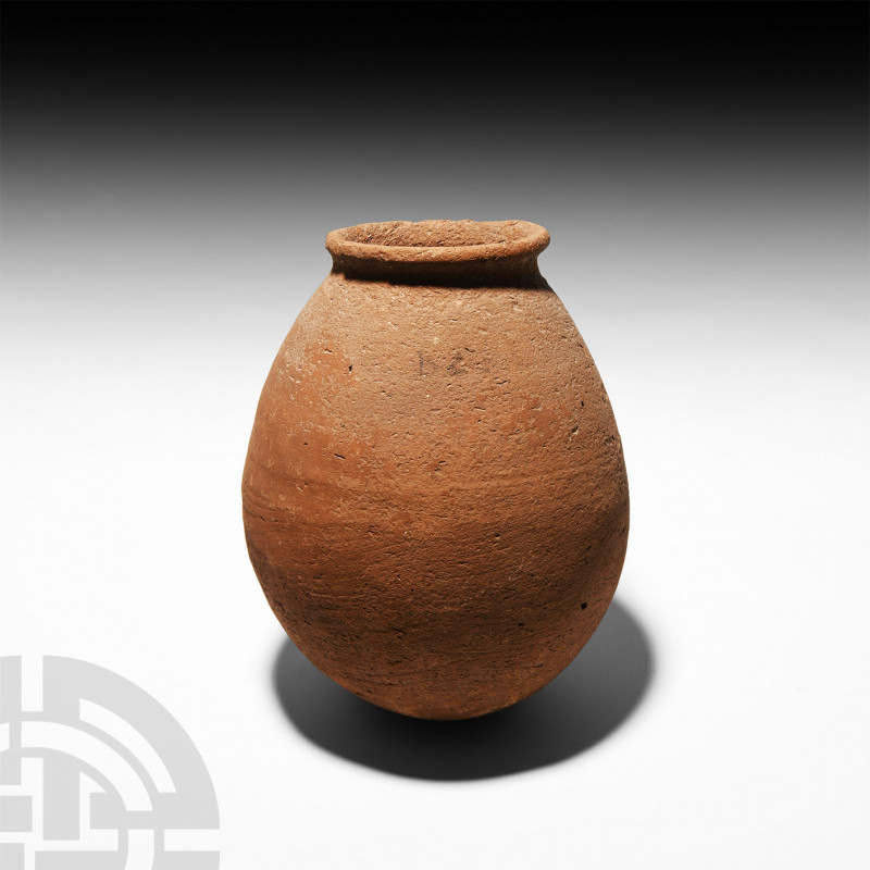Egyptian Terracotta Storage Vessel. New Kingdom, 1550-1070 B.C. A piriform ceram...