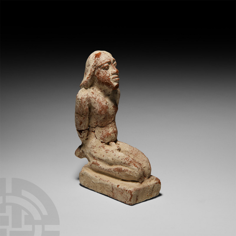 Egyptian Captive Figure. 1st millennium B.C. A ceramic figure modelled in the ro...