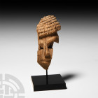 Egyptian Head of a Wooden Figure. New Kingdom, 1550-1070 B.C. A fragment of a carved hard-wood face with semi-naturalistic detailing to the face and h...