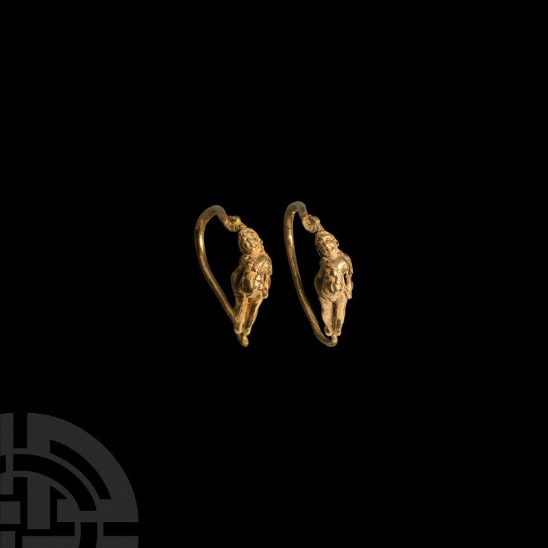 Greek Gold Earrings with Eros. 4th-1st century B.C. A matched pair of gold earri...