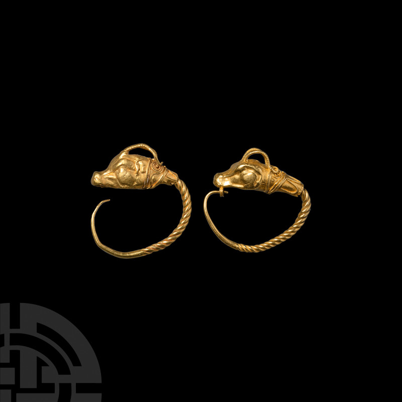 Large Greek Gold Antelope-Headed Earring. 5th-3rd century B.C. A gold earring co...