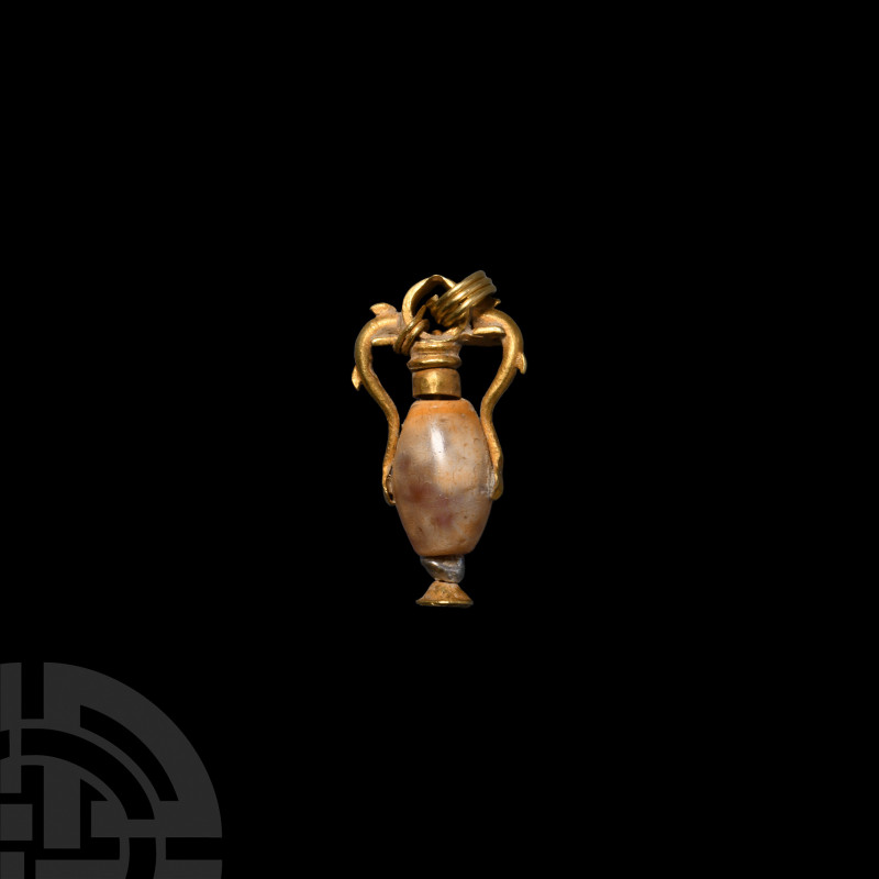 Greek Gold Dolphin Amphora Pendant. 5th-3rd century B.C. An amphora-shaped penda...