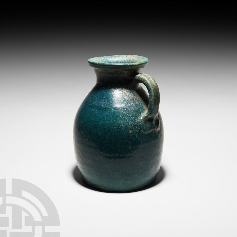 Parthian Blue Glazed Jug. 3rd century B.C.-2nd century A.D. A glazed vessel with...