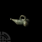 Roman Phallic Pendant. 1st century B.C.-3rd century A.D. A bronze phallic pendant with detailing and suspension loop. 18.2 grams, 36 mm (1 3/8 in.) Ge...
