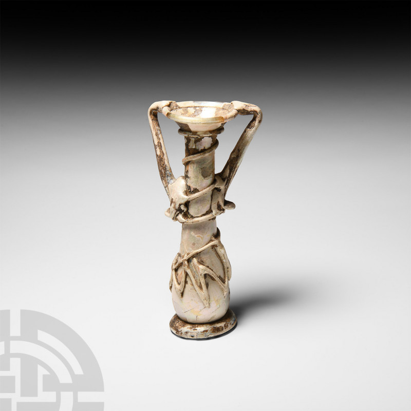 Roman White Iridescent Tall Glass Perfume Bottle. 1st-2nd century A.D. A glass p...