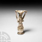 Roman White Iridescent Tall Glass Perfume Bottle. 1st-2nd century A.D. A glass perfume bottle or unguentarium composed of a slender piriform body, fla...