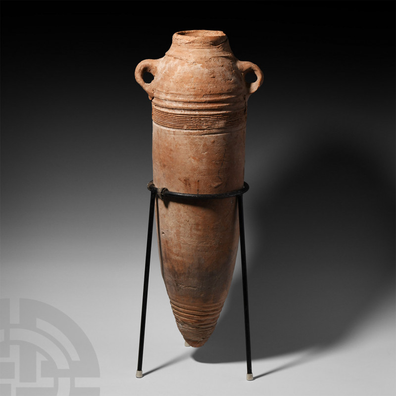 Late Roman Terracotta Amphora. 4th-6th century AD. A tall terracotta transport a...