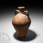 Late Roman Terracotta Amphora. 4th-5th century A.D. A substantial Mediterranean terracotta amphora jar with strap handles to the shoulder. 5.55 kg, 47...