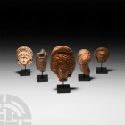 Roman Terracotta Head Collection. Mainly 2nd-3rd century A.D. A mixed group of moulded terracotta female heads comprising: one with large wig of curls...