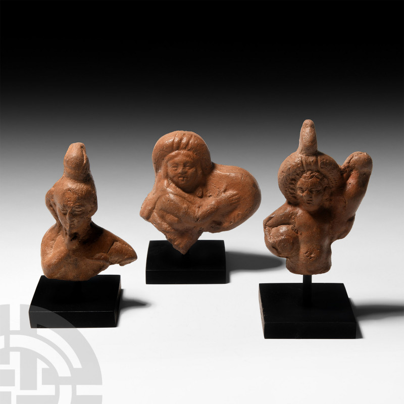 Roman Terracotta Figure Group. 2nd century A.D. A group of votive terracotta fig...