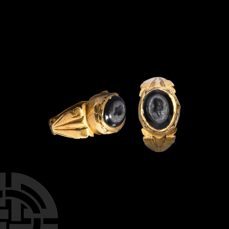 Roman Gold Ring with Portrait Gemstone. 3rd-4th century A.D. A gold ring compose...