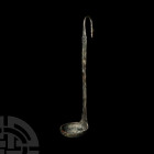 Roman Simpulum Ladle with Swan. 1st-2nd century A.D. A bronze ladle comprising a hemispherical bowl with a flat-section handle, ribbed bulb above and ...