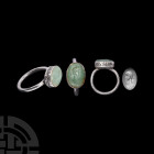 Roman Silver Ring with Emperor Valentinian Gemstone. c.4th century A.D. A silver ring composed of a round-section hoop and oval bezel set with a green...