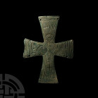 Byzantine Cross Mount with Saint. 11th century A.D. A reliquary cross plate with equal arms, four fastening holes, decorated with nimbate figure of Ch...
