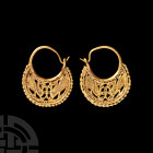 Byzantine Gold Earring Pair with Peacocks. 6th-7th century A.D. A pair of openwork gold earrings with decorative motif composed of two peacocks facing...