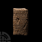 Old Babylonian Cuneiform Tablet for Hammurabi, King of Babylon. c.18th century B.C. A ceramic pillow-shaped cuneiform tablet; accompanied by an old sc...