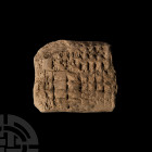 Large Mesopotamian Cuneiform Tablet. 3rd-2nd millennium B.C. A large section of a ceramic cuneiform tablet bearing cuneiform script to both faces, one...