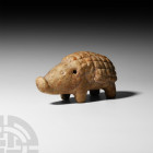 Votive Hedgehog. c.12th century B.C. A marble figure modelled in the round as a hedgehog with stump legs, square hatched spines, circular eyes and snu...