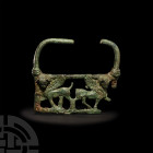 Urartian Cauldron Handle with Winged Bulls. 6th-5th century B.C. A substantial openwork vessel handle with curved profile, rectangular in form with fa...