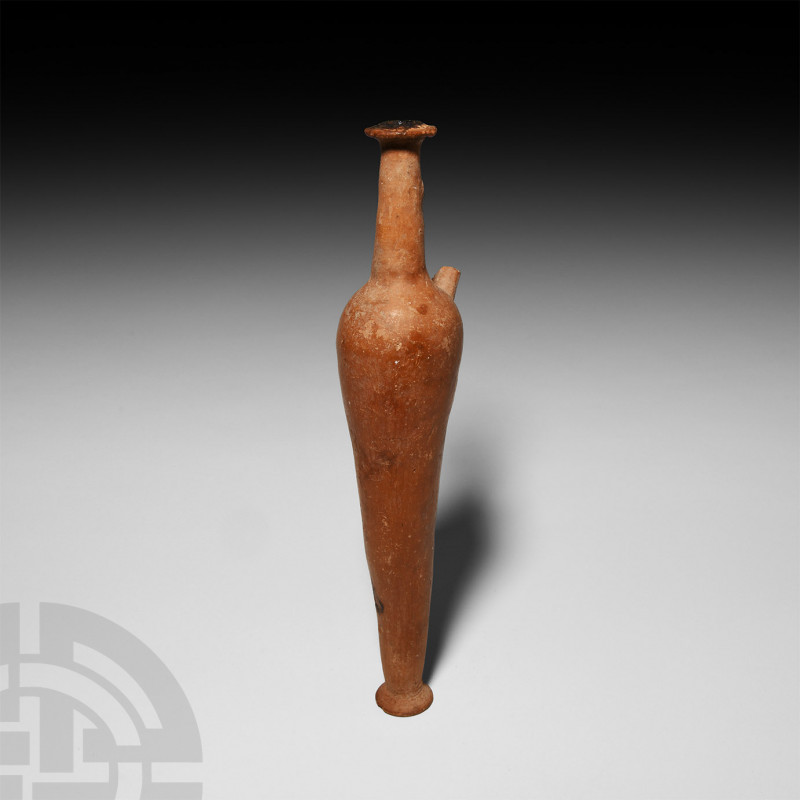 Hellenistic Terracotta Alabastron. 3rd-2nd century B.C. A tall ceramic alabastro...