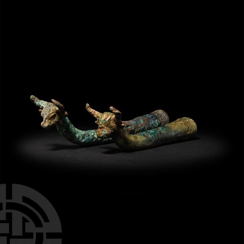Rhyton Pair. 2nd-1st millennium B.C. A pair of bronze model rhyton vessels or wh...