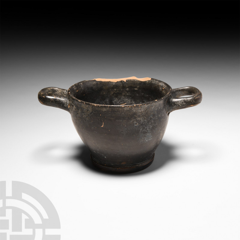 Greek Apulian Blackware Skyphos. c.4th century B.C. A terracotta black-glazed sk...