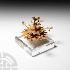 Gold Tree Ornament. 1st millennium B.C. A sheet-gold tree ornament or finial comprising a central stem with three graduated tiers of sheet-gold flower...