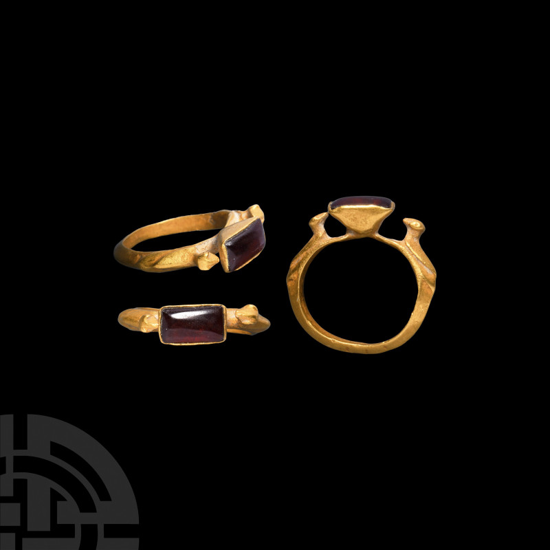 Gold Ring with Birds and Garnet. Early 2nd millennium A.D. A gold ring composed ...