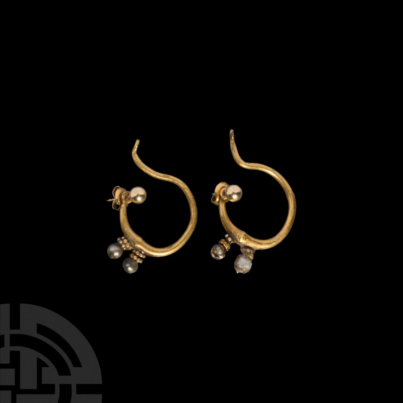 Gold and Pearl Earrings. Early 1st millennium A.D. A matched pair of gold earrin...