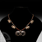 Elamite Silver and Carnelian Bead Necklace with Silver Bird Pendants. 2nd millennium B.C. A restrung necklace composed of silver tubular beads, some w...