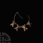 Elamite Silver Child's Bracelet with Frog Pendants. 2nd-1st millennium B.C. A silver child's bracelet composed of a slender round-section hoop with ho...