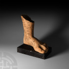 Greek Italic Terracotta Foot. 3rd-2nd century B.C. A large terracotta votive left foot, naturalistically fashioned, good rendering of details of toes....