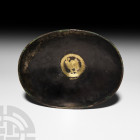 Sassanian Silver Bowl with Engraved Gilded Bird. 6th century A.D. A silver elliptical-shaped bowl with thickened chamfered rim, the centre engraved wi...