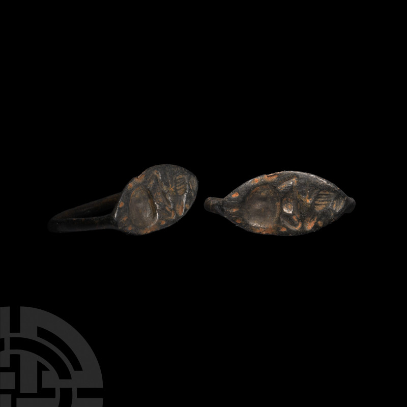 Greek Ring with Animals. c.450 B.C. A bronze ring with rounded hoop tapering tow...