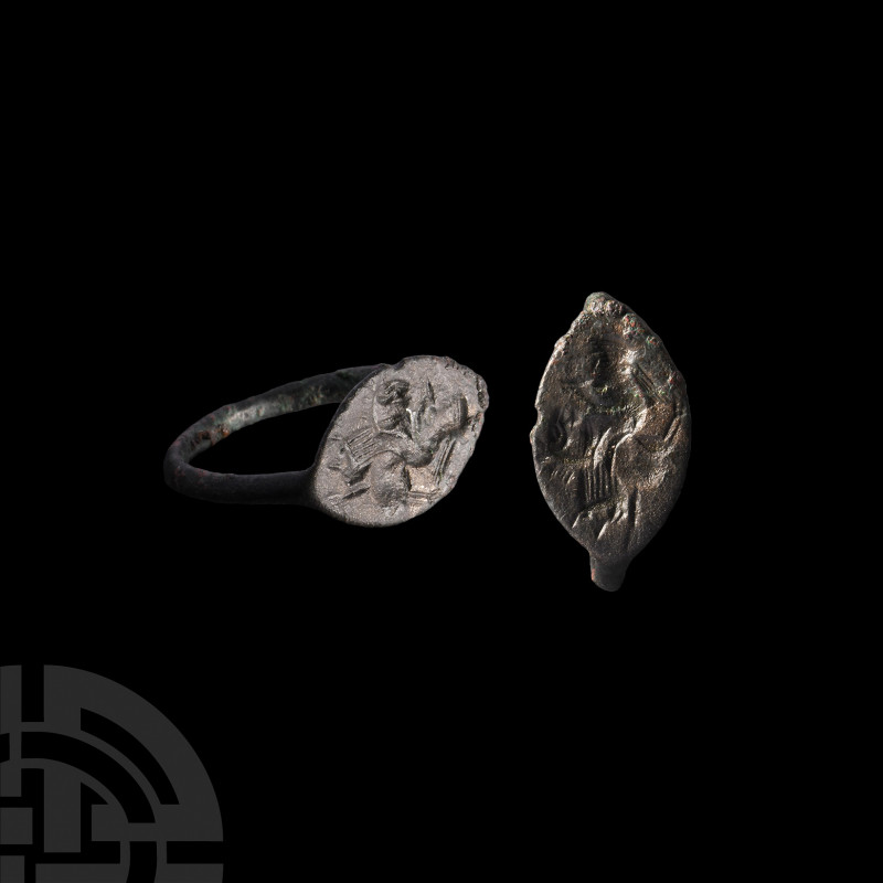 Greek Ring with Priest. 6th-4th century B.C. A bronze ring comprising a thin hoo...
