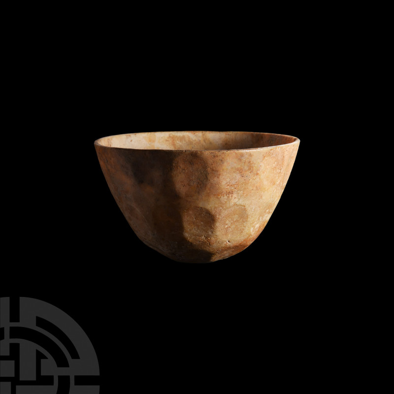 Sassanian Facetted Opaque White Glass Cup. 6th-7th century A.D. A conical opaque...