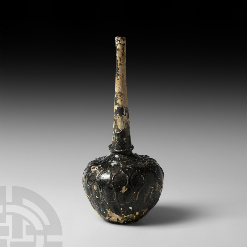 Honeycomb Vessel. 10th-12th century A.D. A glass bottle with globular body, broa...