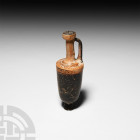 Greek Attic Lekythos. c.5th century B.C. A ceramic lekthyos oil flask composed of a roughly U-section body, broad shoulder, narrow cylindrical neck, D...