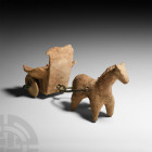 Mesopotamian Horse-Drawn Chariot. 2nd millennium B.C. A stylised standing horse figure attached to a D-shaped shaft, carriage of shallow box form with...