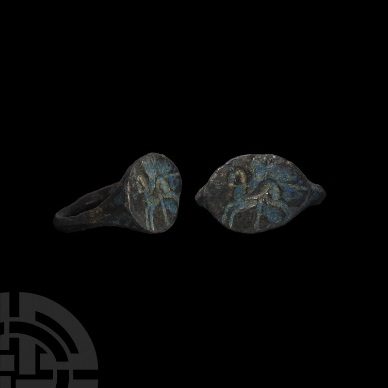 Greek Ring with Horse. c.450 B.C. A bronze ring with facetted hoop tapering upwa...