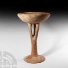Large Amlash Chalice with Cage Foot. 13th-12th century B.C. A terracotta chalice composed of an openwork tripartite stem, bowl with inverted rim and s...